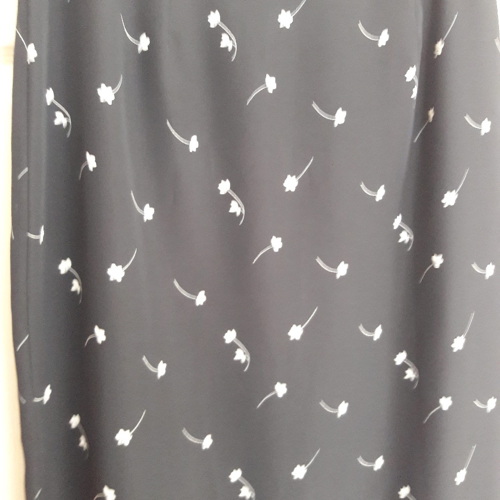 Long Black Skirt with Small White Flower Details
